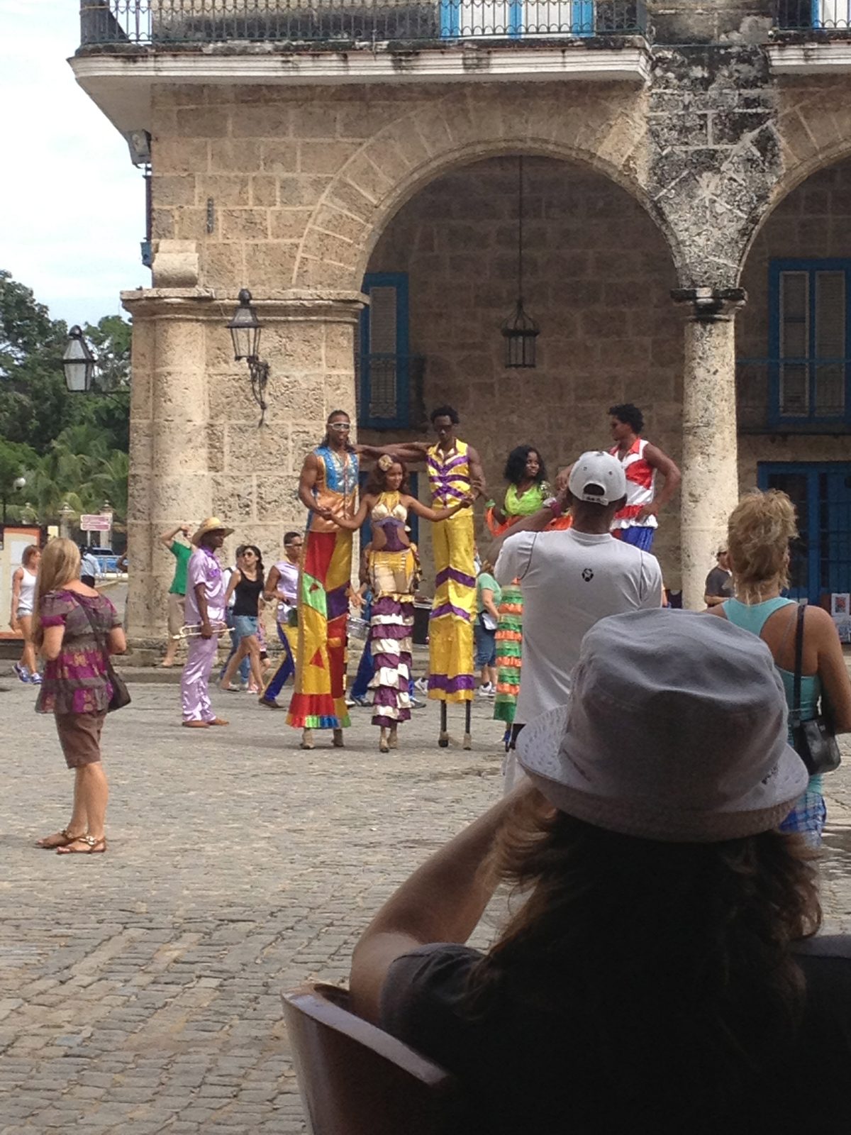 Street artists came walking through the square.